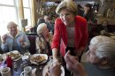 Democratic candidate for U.S. Senate Elizabeth Warren, center, greets people at Dinky's Blue Belle Diner in Shrewsbury, Mass., Sunday, April 29, 2012. Warren and her opponent Republican U.S. Sen. Scott Brown have vowed to fight attack ads on television, radio and the Internet, but in their emailed appeals to supporters, the two routinely portray each other in the harshest light possible. (AP Photo/Steven Senne)