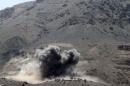 Smoke billows from a Noqum mountain after it was hit by an air strike in Yemen's capital Sanaa
