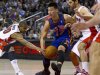 New York Knicks guard Jeremy Lin (17) has the ball stripped as he is double-teamed by Toronto Raptors guards Jose Calderon, right, and Leandro Barbosa during the first half of an NBA basketball game in Toronto on Tuesday, Feb. 14, 2012. (AP Photo/The Canadian Press, Frank Gunn)