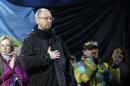 Former economy minister Arseny Yatseniuk stands on the stage during a rally in Independence Square in Kiev