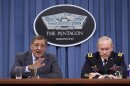 FILE - In this June 29, 2012 file photo, Defense Secretary Leon Panetta, left, accompanied by Joint Chiefs Chairman Gen. Martin Dempsey, gestures during a news conference at the Pentagon. (AP Photo/Evan Vucci)