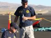 In this handout photo from the National Traffic Safety Board taken Sunday, Sept. 18, 2011 at an airfield in Reno, Nev., shows two NTSB officials looking at wreckage from Jimmy Leeward's plane that crash on Friday. Officials say nine people died.  (AP Photo/National Traffic Safety Board, HO)