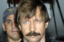 FILE - This Tuesday Nov. 16, 2010 file photo provided by the Drug Enforcement Administration shows Russian arms trafficker Viktor Bout in U.S. custody after being flown from Bangkok to New York in a chartered U.S. plane. The ex-Soviet officer turned arms dealer faces a mandatory minimum of 25 years in prison at sentencing Thursday, April 5, 2012. (AP Photo/Drug Enforcement Administration, File)