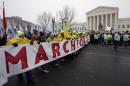 FILE - In this Jan. 22, 2016, file photo, marchers carry a banner during the March for Life 2016, in front of the U.S. Supreme Court in Washington, during the annual rally on the anniversary of 1973 'Roe v. Wade' U.S. Supreme Court decision legalizing abortion. Roe v. Wade could be in jeopardy under Donald Trump's presidency. If a reconfigured high court did overturn it, the likely outcome would be a patchwork: some states protecting abortion access, others enacting tough bans, and many struggling over what new limits they might impose. (AP Photo/Alex Brandon, File)