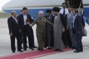 Kurdish president Massoud Barzani, center, welcomes Shiite cleric Muqtada al-Sadr upon his arrival in Irbil, a city in the Kurdish controlled north 217 miles (350 kilometers) north of Baghdad, Iraq, Thursday, April 26, 2012. A hardline Shiite cleric is meeting with the president of Iraq's Kurdish region to try to end a political crisis that has deadlocked the nation's government. Anti-American cleric Muqtada al-Sadr offered plans Thursday to resolve the impasse through political inclusiveness.(AP Photo/Khalid Mohammed)