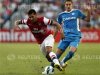 Arsenal's Andre Santos fights for the ball against Kitchee Fc's Jonathan Carril Regueiro during their friendly soccer match in Hong Kong
