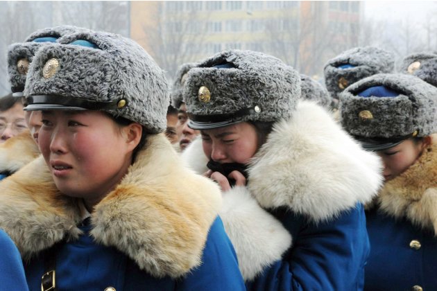 Pyongyang Traffic Girls Crying And Mourning Dear Leader Kim Jong-Il  2011-12-22T041029Z_442452282_GM1E7CM0XXM01_RTRMADP_3_KOREA-NORTH