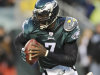 In this Jan. 9, 2011, photo, Philadelphia Eagles quarterback Michael Vick (7) runs from a tackler during the first half of an NFL wild card playoff football game against the Green Bay Packers in Philadelphia. Vick and the Eagles have agreed on a six-year deal. The Eagles made the announcement Monday night, Aug 29, 2011. A source familiar with the negotiations told The Associated Press the deal is worth $100 million, including about $40 million guaranteed. The person spoke to the AP on condition of anonymity because terms weren't released. (AP Photo/Michael Perez)