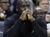 FILE - In this Jan. 16, 2012, file photo, Charlotte Bobcats owner Michael Jordan watches during the first half of an NBA basketball game between the Bobcats and the Cleveland Cavaliers in Charlotte, N.C. Jordan's No. 23 has long been synonymous with greatness. By Thursday night, that number could have a completely different meaning. If Jordan's Charlotte Bobcats lose to the New York Knicks, it will be their 23rd consecutive loss and they'll finish the season with the worst winning percentage in NBA history. (AP Photo/Chuck Burton, File)