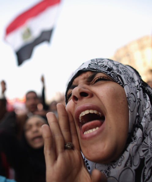 A woman speaks as Egyptians gather in Tahrir Square to mark the one year anniversary of the revolution on January 25, 2012 in Cairo Egypt. Tens of thousands are gathering in the square on the first an