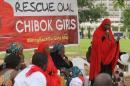 A member of the #BringBackOurGirls Abuja campaign group addresses a protest in Abuja