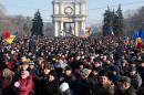 People attend a rally in front of the Parliament building in Chisinau on January 21, 2016