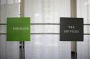 Signs at a H&R Block office are seen in Chicago