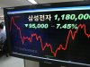 A electronic stock price board shows the 7.45 percent nosedive of  Samsung Electronics Co. share price, to 1,180,000 won (US$1,039.65 ),  at a bank in Seoul, South Korea, Monday, Aug. 27, 2012. Asian markets drifted lower Monday in early trading as Apple's court victory in a high-stakes patent dispute sent shares of Samsung Electronics and its affiliates into a tailspin. The letters on a screen read " Samsung Electronics Co". (AP Photo/Yonhap, Suh Myung-gon)  KOREA OUT