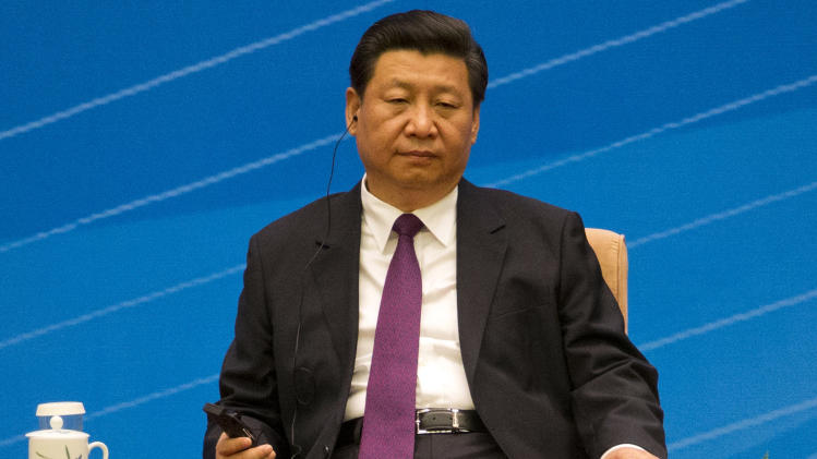 In this photo taken June 28, 2014, Chinese President Xi Jinping attends the Conference marking the 60th anniversary of the Five principles of Peaceful Coexistence at the Great Hall of the People in Beijing, China. “We should work for a new architecture of Asia-Pacific security cooperation that is open, transparent and equality based,” Chinese President Xi told dignitaries from India and Myanmar. “The notion of dominating international affairs belongs to a different age and such an attempt is doomed to failure.” Yet despite Xi’s depiction of China as a “peaceful, amiable and civilized lion,” the country’s moves have so far only set off alarms across the region and pushed other Asian countries to seek backup from Washington. (AP Photo/Ng Han Guan)