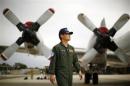 Japan's Maritime Self-Defence Force Commander Iwamasa is pictured in front of one of P-3C Orion aircraft currently at RAAF Base Pearce near Perth