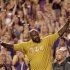 FILE - In this Sept. 10, 2011, file photo, former LSU and NBA basketball star Shaquille O'Neal acknowledges the crowd as he is introduced over the public-address system during an NCAA college football game between LSU and Northwestern State in Baton Rouge, La. Fans have turned Twitter into a digital version of the autograph session, asking _ sometimes begging or pleading _ stars from every sport for a shoutout. Oh, sure, some requests are designed to raise the profile of a charitable cause. But most fans are simply looking for a little love from their favorite athletes like Shaq. (AP Photo/Gerald Herbert, File)