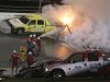 Emergency workers put out a fire on a jet dryer during the NASCAR Daytona 500 auto race at Daytona International Speedway in Daytona Beach, Fla., Monday, Feb. 27, 2012. (AP Photo/Bill Friel)