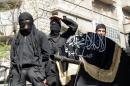 Members of Al-Nusra Front take part in a parade in Aleppo, on October 25, 2013