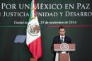 Mexico's President Enrique Pena Nieto speaks during a ceremony at the National Palace in Mexico City, Thursday, Nov. 27, 2014. Mexico's president announced a new anti-crime plan that includes proposals for a nationwide ID, giving Congress the power to dissolve corrupt municipal government and fold their often-corrupt local police forces under the control of the country's 31 state governments. The plan would focus first on four of Mexico's most troubled states, Guerrero, Michoacan, Jalisco and Tamaulipas. (AP Photo/Eduardo Verdugo)