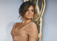 Actress Demi Lovato arrives at the ALMA Awards in Santa Monica, Calif., Saturday, Sept. 10, 2011. The 2011 NCLR ALMA Awards are held to honor those who promote "fair, accurate and balanced" portrayals of Latinos in the entertainment industry. (AP Photo/Jason Redmond)
