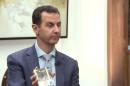 EXCLUSIVE: Defiant Assad tells Yahoo News torture report is 'fake news'
