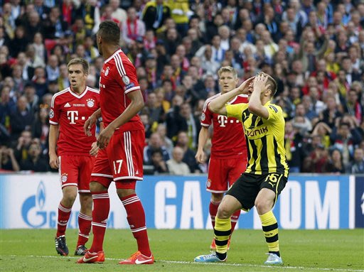 Dortmund's Jakub Blaszczykowski of Poland, right, reacts after missing a chance to score, during the Champions League Final soccer match between Borussia Dortmund and Bayern Munich, at Wembley Stadium