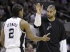 San Antonio Spurs' Tim Duncan, right, celebrates with teammate Kawhi Leonard (2) during the fourth quarter of an NBA basketball game against the Portland Trail Blazers, Monday, April 23, 2012, in San Antonio. San Antonio won 124-89, clinching the No. 1 seed in the Western Conference. (AP Photo/Eric Gay)