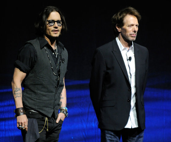 LAS VEGAS, NV - APRIL 24: Actor Johnny Depp (L) and producer Jerry Bruckheimer speak at a Walt Disney Studios Motion Pictures presentation to promote their upcoming film, "The Lone Ranger" at The Colosseum at Caesars Palace during CinemaCon, the official convention of the National Association of Theatre Owners, April 24, 2012 in Las Vegas, Nevada. (Photo by Ethan Miller/Getty Images)