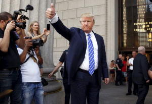 U.S. Republican presidential candidate Donald Trump gestures after arriving for jury duty at Manhattan Supreme Court in New York