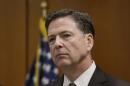 FBI Director James Comey addresses the media after visiting with employees and other law enforcement officials, Tuesday, April 5, 2016, in Detroit. (AP Photo/Carlos Osorio)