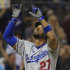 Los Angeles Dodgers' Matt Kemp points skyward as he reaches home plate after hitting a solo home run in the seventh inning against the San Diego Padres during a baseball game, Friday, Sept. 23, 2011, in San Diego. It was Kemps' 37th home run of the season and came on his 27th birthday.  (AP Photo/Lenny Ignelzi)