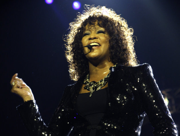 FILE - In this April 25, 2010 file photo, singer Whitney Houston performs at the o2 in London as part of her European tour. An autopsy report shows that cocaine was found in Houston's system and that investigators recovered whity powdery substances from her hotel room. Houston died Feb. 11, in California at the age of 48. (AP Photo/Joel Ryan, file)