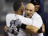 New York Yankees' Alex Rodriguez, left, embraces Raul Ibanez after Ibanez hit a 12th inning, walk-off RBI single to give the Yankees a 4-3 win in their baseball game against the Boston Red Sox at Yankee Stadium in New York, Tuesday, Oct. 2, 2012. (AP Photo/Kathy Willens)