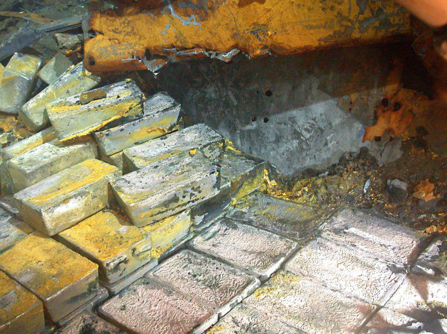 This image taken July 5, 2012 provided by Odyssey Marine, Inc. shows the discovery of silver on the SS Gairsoppa. Forty-eight tons of silver bullion has been recovered from the SS Gairsoppa and returned to the British Government the company announced Wednesday July 18, 2012. The record-breaking operation has so far produced the heaviest and deepest recovery of precious metals from a shipwreck. (AP Photo/Odyssey Marine Inc.)