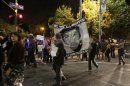 Protesters march in the Leimert Park area of Los Angeles following the George Zimmerman verdict