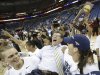 Connecticut players celebrate as they carry head coach Geno Auriemma off the court after defeating Louisville 93-60 in the national championship game of the women's Final Four of the NCAA college basketball tournament, Tuesday, April 9, 2013, in New Orleans. (AP Photo/Gerald Herbert)
