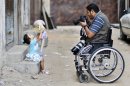 Photos: Disabled photographer keeps shooting