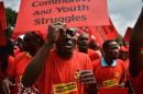 Striking members of NUMSA demonstrate for better wages in Johannesburg on March 19, 2014