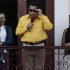 Accompanied by relatives, Venezuela's President Hugo Chavez, center, wears sunglasses as he speaks to supporters from a balcony of Miraflores presidential palace in Caracas, Venezuela, Thursday, July 28, 2011. Chavez sang on a balcony of the presidential palace as he celebrated his 57th birthday before a crowd of supporters, vowing to overcome cancer. (AP Photo/Ariana Cubillos)