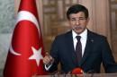 Turkey's Prime Minister Ahmet Davutoglu gives a speech during a press conference after his visit at the Turkish Council of State in Ankara on July 24, 2015, vowing to continue operations against the jihadists