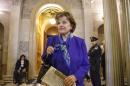 Senate Intelligence Committee Chair Sen. Dianne Feinstein, D-Calif. leaves the Senate chamber on Capitol Hill in Washington, Tuesday, March 11, 2014, after saying that the CIA's improper search of a stand-alone computer network established for Congress has been referred to the Justice Department. The issue stems from the investigation into allegations of CIA abuse in a Bush-era detention and interrogation program. (AP Photo/J. Scott Applewhite)