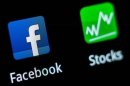 A Facebook application logo is pictured on a mobile phone in this photo illustration taken in Lavigny