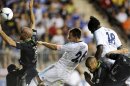 Chelsea FC's John Terry (26) heads the ball over MLS All-Stars' Aurelien Collin (78), of Sporting Kansas City, to score during the first half of soccer's MLS All-Star game, Wednesday, July 25, 2012, in Chester, Pa. (AP Photo/Michael Perez)