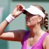 Kvitova of the Czech Republic adjusts her cap during her match against Barty of Australia during the French Open tennis tournament at the Roland Garros stadium in Paris