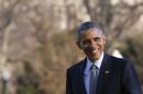 U.S. President Barack Obama smiles as he walks on the South Lawn of the White House in Washington