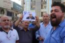 Demonstrators gather in the town of Fuheis, near the capital Amman, on September 25, 2016, denouncing the killing of Jordanian writer Nahed Hattar