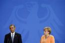 File photo of U.S. President Obama and German Chancellor Merkel holding a joint news conference in Berlin