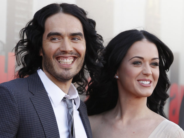 FILE- In this Tuesday, April 19, 2011 file photo, British actor Russell Brand and his wife Katy Perry arrive for the European premiere of Arthur, in London. (AP Photo/Joel Ryan, FILE
