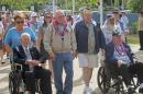 USS Arizona survivors from left, John Anderson, Don Stratton, Louis Conter and Lauren Bruner arrive Tuesday, Dec. 2, 2014, in Pearl Harbor, Hawaii. Four of the remaining nine USS Arizona survivors of the Pearl Harbor attack are vowing this year's anniversary of the 1941 attack won't be their last reunion. Even though it's the last official survivor gathering of the USS Arizona Reunion Association, the men say they still plan to get together, even if not in Hawaii. Sunday marks the 73rd anniversary of the Japanese attack that killed roughly 2,400 sailors, Marines and soldiers. (AP Photo/Audrey McAvoy)